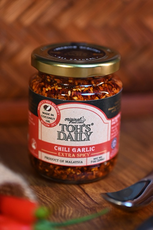 A jar of chili garlic

Description automatically generated