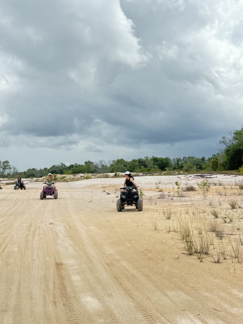 A group of people on atvs

Description automatically generated