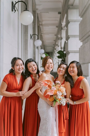 A group of women in red dresses

Description automatically generated